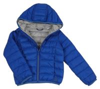 Tmavomodrá šusťáková lehce zateplená bunda s kapucí 