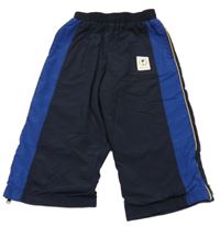 Tmavomodro-safírové šusťákové podšité kalhoty s nášivkou M&S