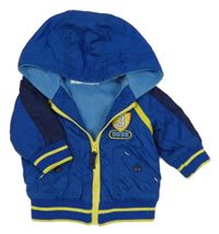 Modrá šusťáková jarní bunda se žlutým zipem a kapucí M&Co.