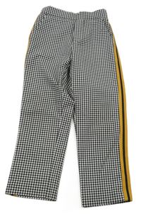 Černo-bílé kostičkované kalhoty s okrovým pruhem Zara