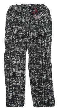 Černo-bílé vzorované skinny kalhoty s ozdobou 