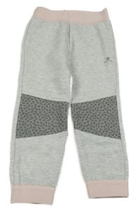 Šedo-růžové tepláky s logem Domyos