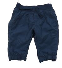 Tmavomodré šusťákové podšité kalhoty s úpletovým pasem C&A