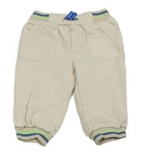 Smetanové tepláky s barevnými pruhy 