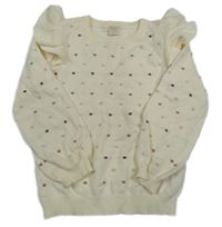 Smetanový žebrovaný puntíkatý svetr s volánky