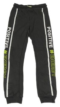 Tmavošedé tepláky s pruhem a nápisem Y.F.K.