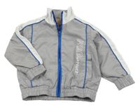 Šedo-modro-bílá šusťáková jarní bunda s nápisem