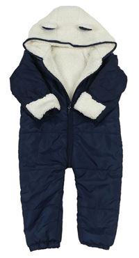 Tmavomodrá prošívaná šusťáková zimní kombinéza s bílou huňatou kapucí s oušky Matalan