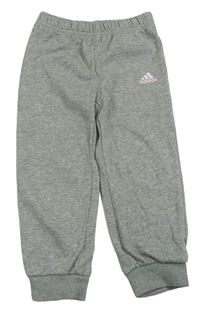 Světlešedé tepláky s logem Adidas