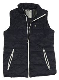 Tmavomodrá šusťáková zateplená vesta Staccato