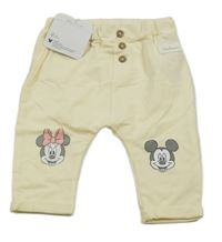 Nové - smetanové tepláky s Minnie a Mickeym Sinsay