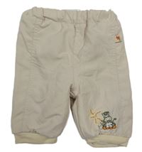 Béžové šusťákové zateplené kalhoty s výšivkou 