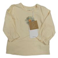 Nové - Světlebéžové triko s kytičkou Name it