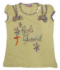 Žluto-béžové tričko s nápisem a 3D mašlemi 