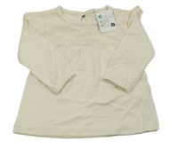 Nové - Smetanové triko s madeirou a volánky Zeeman