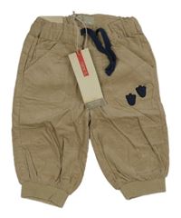 Nové - béžové cuff manšestráky s tlapkami name it.