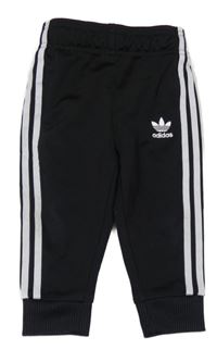 Černo-bílé sportovní tepláky s pruhy Adidas