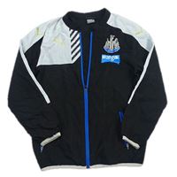 Černo-bílá šusťáková sportovní bunda Newcastle United s logem Puma