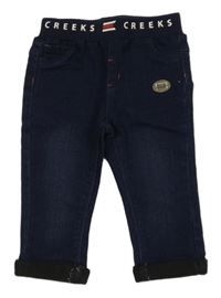 Tmavomodré džegíny s úpletovým pasem 