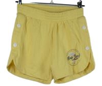 Dámské žluté teplákové kraťasy s nápisem 