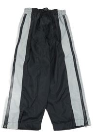 Černo-šedé šusťákové kalhoty se zipy 