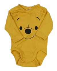 Tmavožluté body s Pú H&M