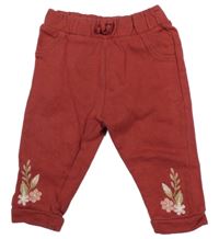 Červené tepláky s kytičkami C&A