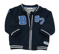 Tmavomodrá plátěná jarní bunda s písmenem Next