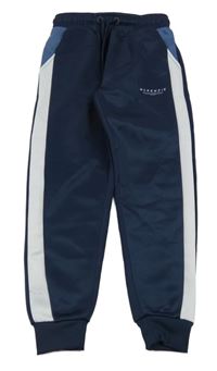 Tmavomodro-bílé sportovní tepláky s logem McKenzie