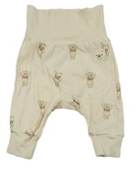 Smetanové tepláky s medvídkem Pú H&M