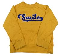 Hořčicová mikina s nápisem John Lewis