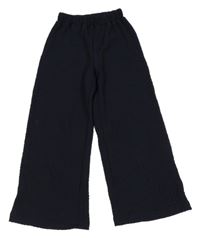 Tmavomodré vzorované culottes kalhoty H&M