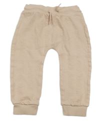 Pudrové vzorované tepláky 