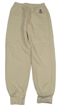 Světlebéžové tepláky s nápisem River Island