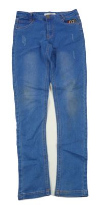 Modré skinny teplákové rifle s číslem a ošoupaného vzhledu CASTRO