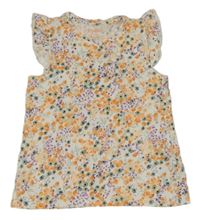 Bílé tričko s kytičkami a volánky lupilu