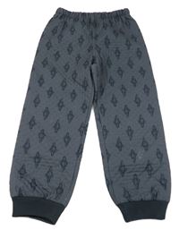 Tmavomodré šusťákové lehce zateplené kalhoty s raketami 