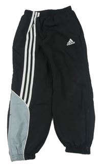 Černé šusťákové kalhoty s pruhy Adidas