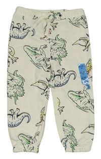 Nové - Smetanové tepláky s dinosaury Primark