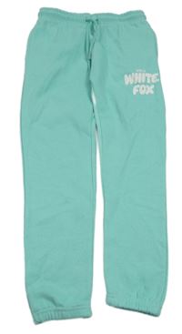 Tyrkysové tepláky s nápisem 