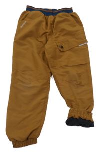 Hnědé šusťákové zateplené cuff kalhoty Quechua