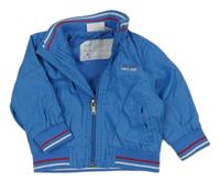 Modrá šusťáková jarní bunda s nápisem Impidimpi