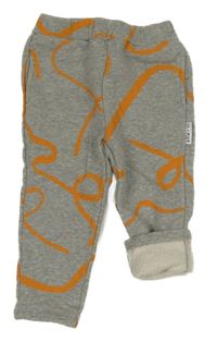 Šedo-oranžové vzorované tepláky 