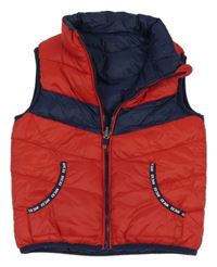 Červeno-tmavomodrá prošívaná šusťáková zateplená oboustranná vesta C&A