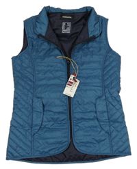 Nové - Petrolejová šusťáková prošívaná jezdecká zateplená vesta Decathlon