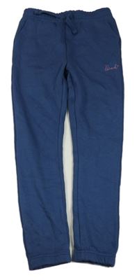 Tmavomodré tepláky s logem Bench