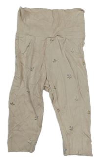 Béžové tepláky s kytičkami H&M