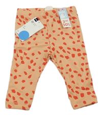 Nové - Oranžové legíny s flíčky Hema 