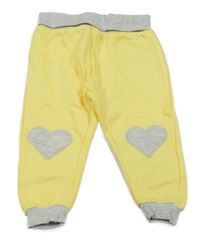 Žluté tepláky se srdíčky Disney