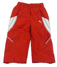 Červené šusťákové kalhoty zn. Adidas